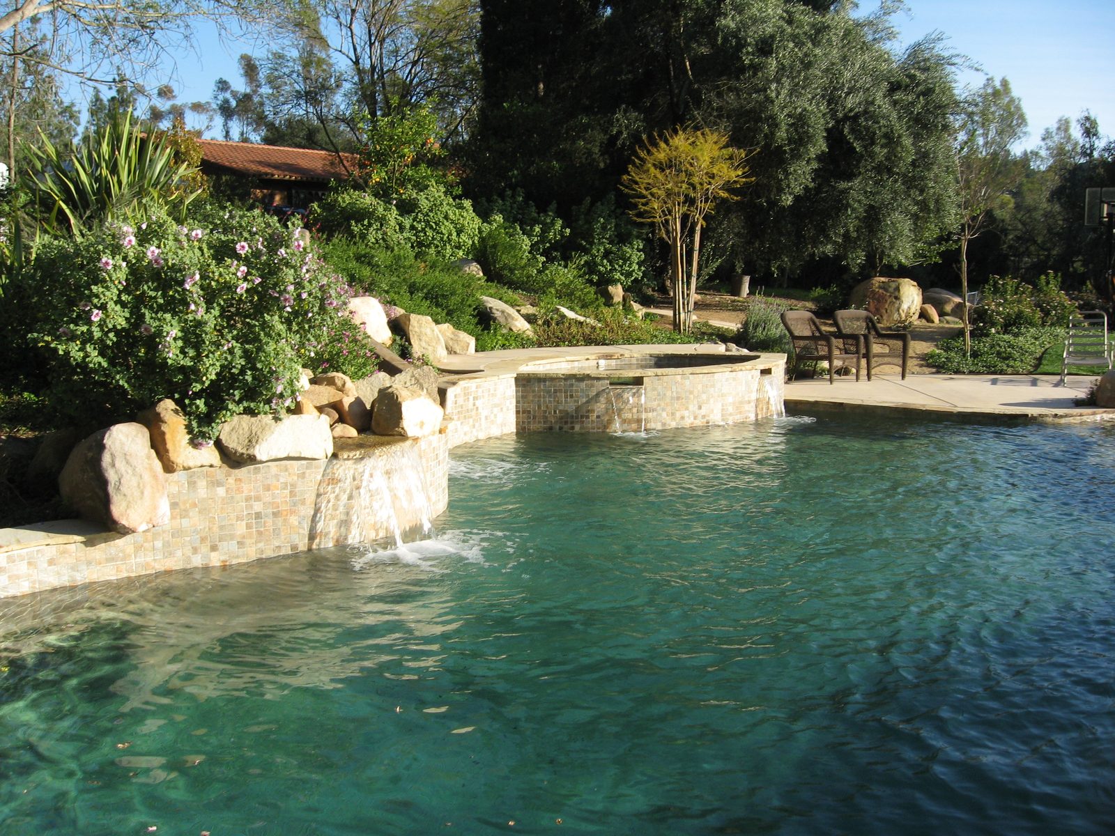 Fiske Residence &mdash; Freeform pool and spa with a boulder waterfall