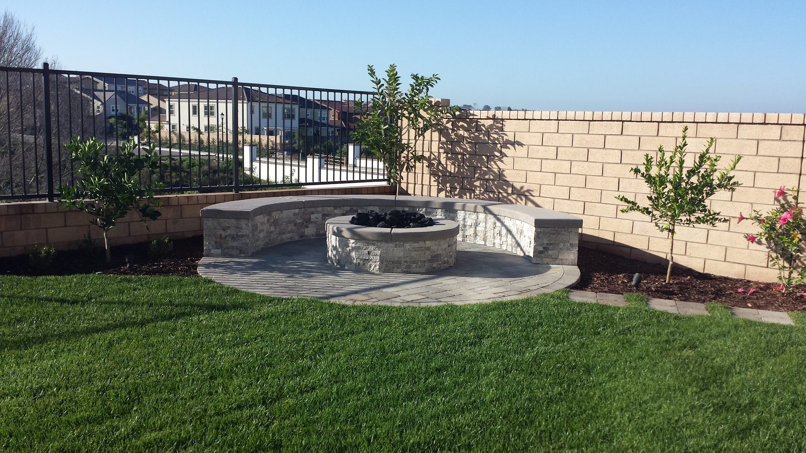 Krishran Residence &mdash; Stone fire pit and seat wall with the view