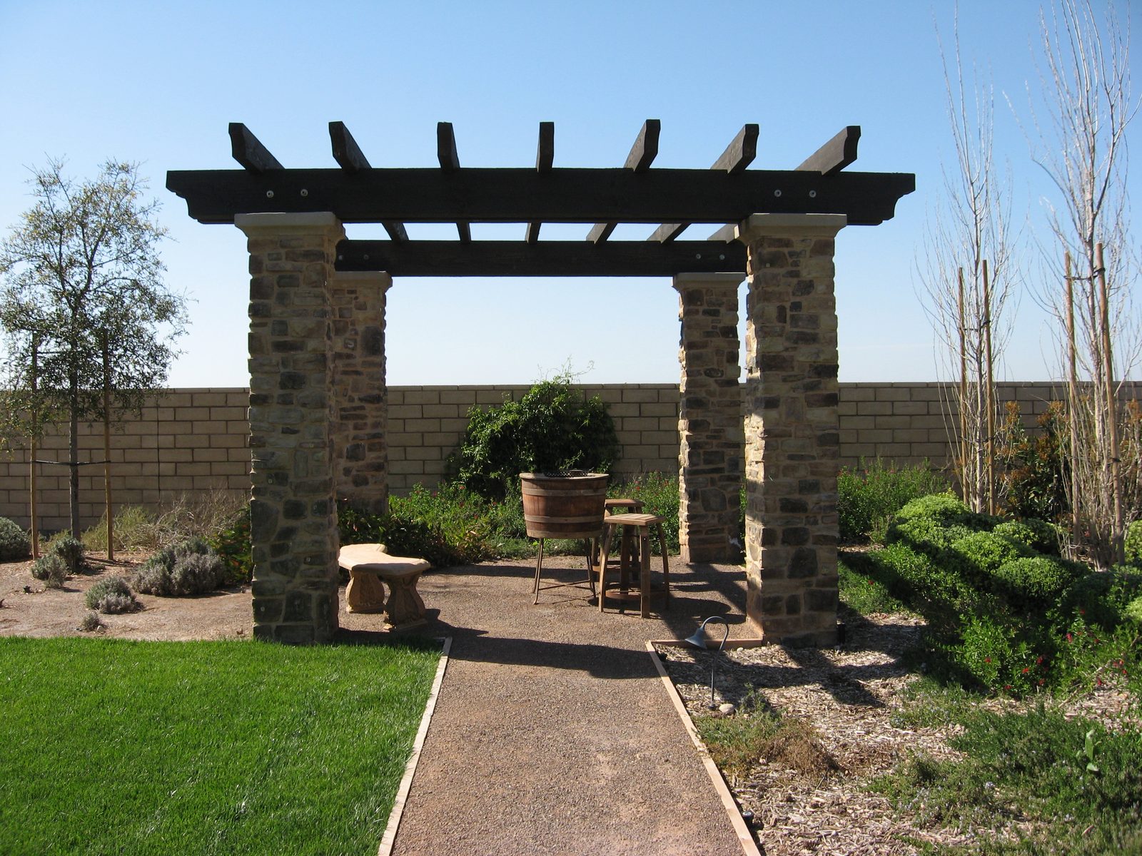 Modello Residence &mdash; Stone-column pergola over the garden path