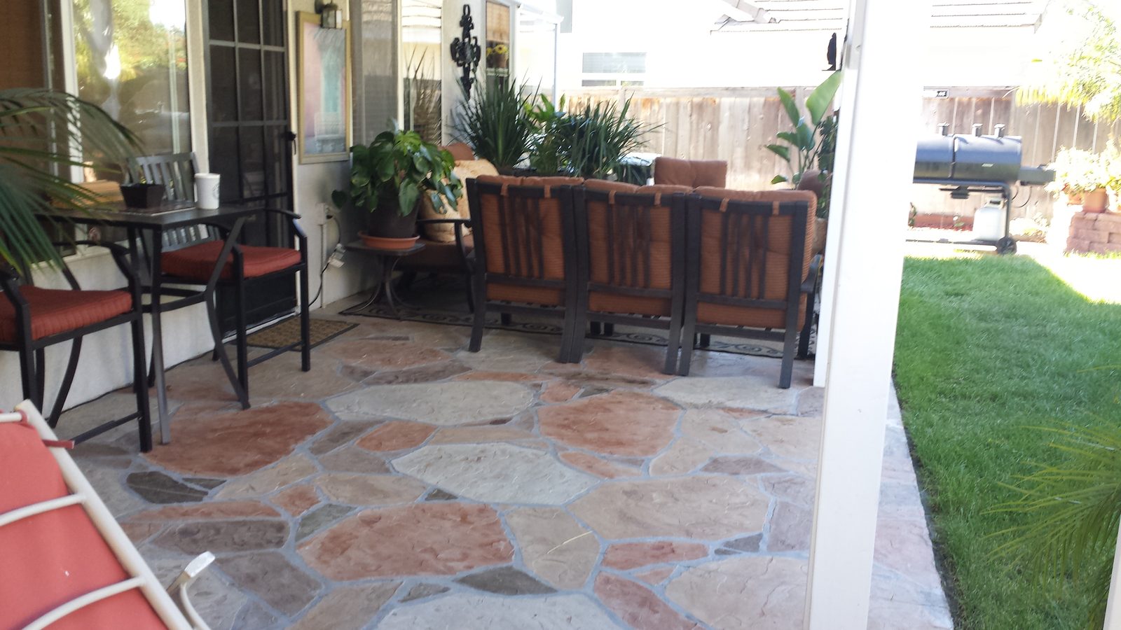 Natural-stone patio sized to how the family uses the yard, San Diego County