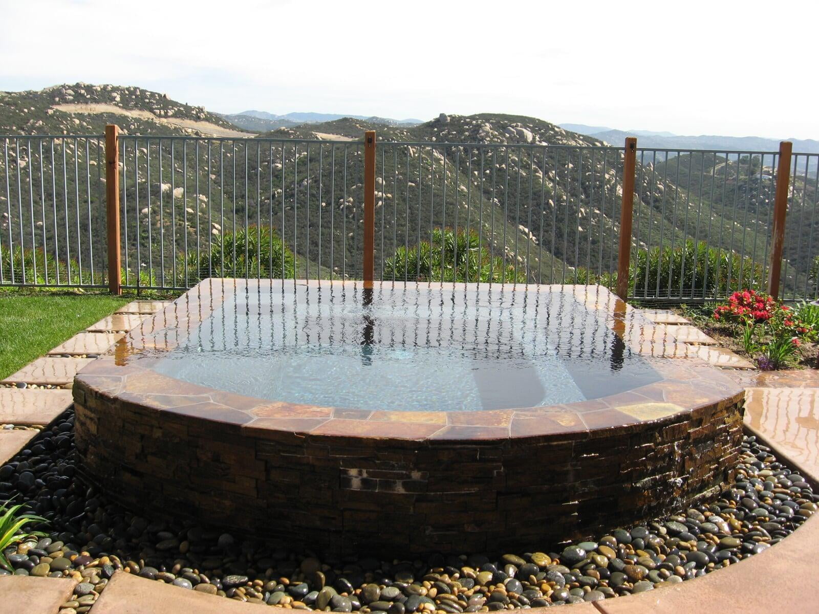 Freeform pool integrated into an established hillside garden in San Diego County